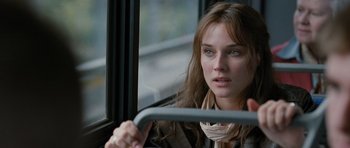Movie still from “Mr. Nobody” (2009), directed by Jaco Van Dormael – A beautiful young woman sitting on a bus; Close Up shot, Over the shoulder angle