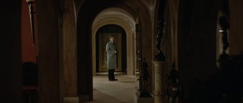 Movie still from “Mr. Nobody” (2009), directed by Jaco Van Dormael – A man standing in an archway in a building; Wide shot, High angle