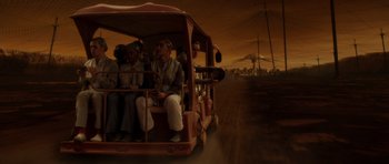 Movie still from “Mr. Nobody” (2009), directed by Jaco Van Dormael – A group of people riding in a trolley car; Wide shot, High angle