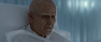 Movie still from “Mr. Nobody” (2009), directed by Jaco Van Dormael – An old man with a wrinkled face sitting in a chair; Close Up shot, Low angle