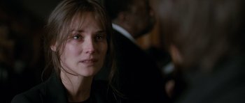 Movie still from “Mr. Nobody” (2009), directed by Jaco Van Dormael – A person wearing a suit and tie; Close Up shot, Over the shoulder angle