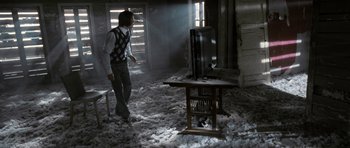 Movie still from “Mr. Nobody” (2009), directed by Jaco Van Dormael – A man standing in the middle of a living room; Wide shot, High angle