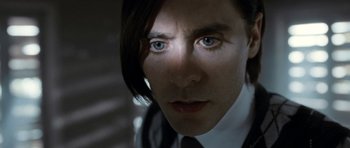 Movie still from “Mr. Nobody” (2009), directed by Jaco Van Dormael – A person wearing a suit and tie; Extreme Close Up shot, Overhead angle