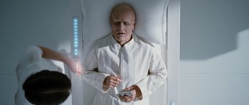 Movie still from “Mr. Nobody” (2009), directed by Jaco Van Dormael – An old man in a white shirt is laying in a bed; Medium shot, Overhead angle