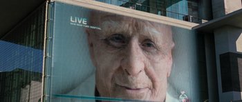Movie still from “Mr. Nobody” (2009), directed by Jaco Van Dormael – An old man with white hair is on the side of a building; Extreme Close Up shot, Low angle