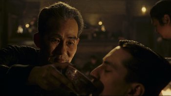 Movie still from “Once Upon a Time in America” (1984), directed by Sergio Leone – Two men are having a drink in a bar; Close Up shot, Over the shoulder angle