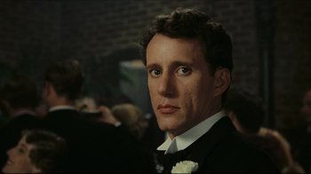 Movie still from “Once Upon a Time in America” (1984), directed by Sergio Leone – A person wearing a suit and tie; Close Up shot, Over the shoulder angle