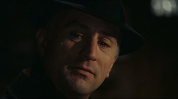 Movie still from “Once Upon a Time in America” (1984), directed by Sergio Leone – A person wearing a hat; Close Up shot, Over the shoulder angle