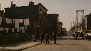 Movie still from “Once Upon a Time in America” (1984), directed by Sergio Leone – A group of people walking down a street; Extreme Wide shot, High angle