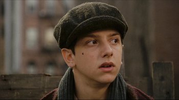 Movie still from “Once Upon a Time in America” (1984), directed by Sergio Leone – A young man wearing a hat and a scarf; Close Up shot, Low angle