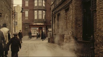 Movie still from “Once Upon a Time in America” (1984), directed by Sergio Leone – An old photo of people walking down the street; Extreme Wide shot, High angle