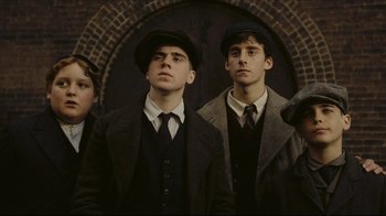 Movie still from “Once Upon a Time in America” (1984), directed by Sergio Leone – A group of young men standing next to each other; Medium shot, Low angle