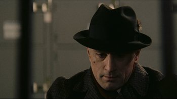 Movie still from “Once Upon a Time in America” (1984), directed by Sergio Leone – A person wearing a hat; Close Up shot, Over the shoulder angle