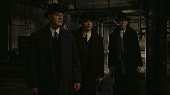 Movie still from “Once Upon a Time in America” (1984), directed by Sergio Leone – A group of men wearing suits and hats; Medium shot, Low angle