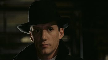 Movie still from “Once Upon a Time in America” (1984), directed by Sergio Leone – A person wearing a hat; Close Up shot, Over the shoulder angle