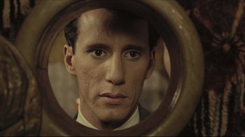 Movie still from “Once Upon a Time in America” (1984), directed by Sergio Leone – A person looking at a mirror; Close Up shot, High angle