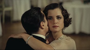 Movie still from “Once Upon a Time in America” (1984), directed by Sergio Leone – A man and a woman in formal wear embracing each other; Close Up shot, Over the shoulder angle