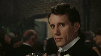 Movie still from “Once Upon a Time in America” (1984), directed by Sergio Leone – A person wearing a suit and tie; Close Up shot, Over the shoulder angle