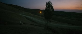 Movie still from “Once Upon a Time in Anatolia” (2011), directed by Nuri Bilge Ceylan – A tree in the middle of a field at night; Extreme Wide shot, High angle