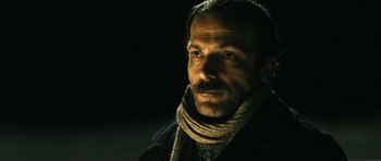Movie still from “Once Upon a Time in Anatolia” (2011), directed by Nuri Bilge Ceylan – A person wearing a scarf and a jacket; Close Up shot, Low angle