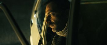 Movie still from “Once Upon a Time in Anatolia” (2011), directed by Nuri Bilge Ceylan – A person looking out of a car window; Close Up shot, Low angle