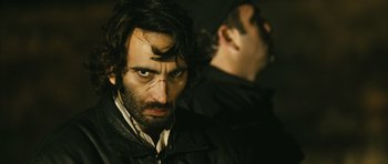Movie still from “Once Upon a Time in Anatolia” (2011), directed by Nuri Bilge Ceylan – A man in a black jacket and a man in a brown jacket; Close Up shot, Over the shoulder angle