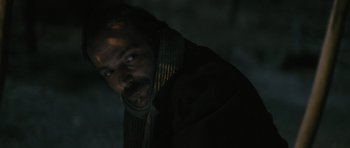 Movie still from “Once Upon a Time in Anatolia” (2011), directed by Nuri Bilge Ceylan – A person wearing a scarf; Close Up shot, Over the shoulder angle