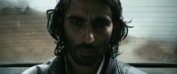 Movie still from “Once Upon a Time in Anatolia” (2011), directed by Nuri Bilge Ceylan – A person with long hair; Close Up shot, Low angle