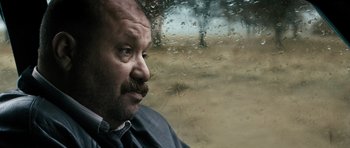 Movie still from “Once Upon a Time in Anatolia” (2011), directed by Nuri Bilge Ceylan – A person looking out of a car window; Close Up shot, Low angle