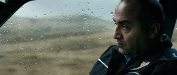 Movie still from “Once Upon a Time in Anatolia” (2011), directed by Nuri Bilge Ceylan – A person looking out of a car window; Close Up shot, Over the shoulder angle