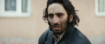 Movie still from “Once Upon a Time in Anatolia” (2011), directed by Nuri Bilge Ceylan – A person wearing a leather jacket; Close Up shot, Low angle