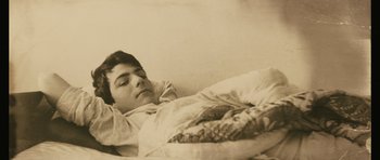 Movie still from “Once Upon a Time in Anatolia” (2011), directed by Nuri Bilge Ceylan – A man laying in a bed with his eyes closed; Close Up shot, High angle