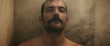 Movie still from “Once Upon a Time in Anatolia” (2011), directed by Nuri Bilge Ceylan – A person with a mustache; Close Up shot, Low angle