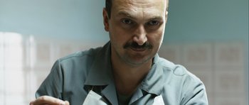 Movie still from “Once Upon a Time in Anatolia” (2011), directed by Nuri Bilge Ceylan – A person with a mustache; Close Up shot, Low angle