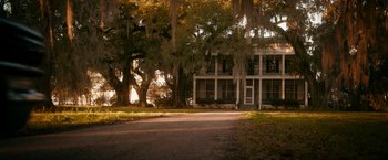 Movie still from “One Night in Miami...” (2020), directed by Regina King – A house with a lot of trees in front of it; Extreme Wide shot, High angle