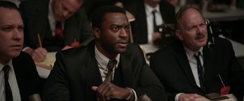 Movie still from “One Night in Miami...” (2020), directed by Regina King – A man in a suit and a tie; Close Up shot, Over the shoulder angle