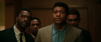 Movie still from “One Night in Miami...” (2020), directed by Regina King – A group of men standing next to each other in a room; Close Up shot, Over the shoulder angle