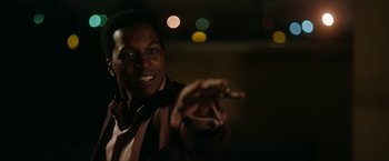 Movie still from “One Night in Miami...” (2020), directed by Regina King – A man is holding something in his hand; Close Up shot, Low angle