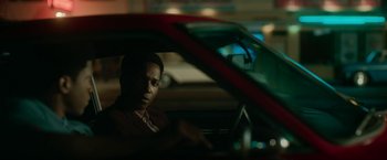 Movie still from “One Night in Miami...” (2020), directed by Regina King – A man sitting in the driver's seat of a car at night; Close Up shot, Over the shoulder angle