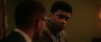 Movie still from “One Night in Miami...” (2020), directed by Regina King – A man in a brown jacket and a man in a brown suit; Close Up shot, Over the shoulder angle