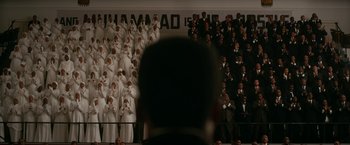 Movie still from “One Night in Miami...” (2020), directed by Regina King – A group of men in suits and ties standing next to each other; Extreme Wide shot, Over the shoulder angle