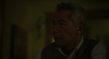 Movie still from “Orphan: First Kill” (2022), directed by William Brent Bell – An older man sitting in front of a window; Close Up shot, Over the shoulder angle