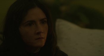 Movie still from “Orphan: First Kill” (2022), directed by William Brent Bell – A person with long dark hair; Close Up shot, High angle