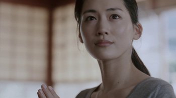 Movie still from “Our Little Sister” (2015), directed by Kore-eda Hirokazu – A person wearing a gray shirt; Close Up shot, Low angle