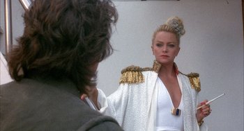 Movie still from “Overboard” (1987), directed by Garry Marshall – A woman in a white dress looking in the mirror; Medium shot, Over the shoulder angle