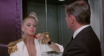Movie still from “Overboard” (1987), directed by Garry Marshall – A man and a woman in front of a bathroom mirror; Close Up shot, Over the shoulder angle