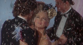 Movie still from “Overboard” (1987), directed by Garry Marshall – A group of young people dancing at a party; Close Up shot, Low angle