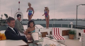 Movie still from “Overboard” (1987), directed by Garry Marshall – A group of women in bathing suits standing on a boat; Wide shot, High angle