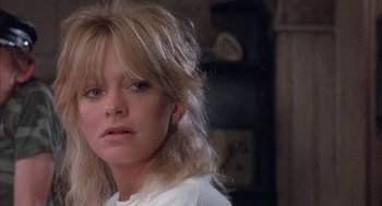 Movie still from “Overboard” (1987), directed by Garry Marshall – A person wearing a white shirt; Close Up shot, Low angle