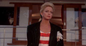 Movie still from “Overboard” (1987), directed by Garry Marshall – A woman with blonde hair wearing a red and white striped shirt; Medium shot, Low angle